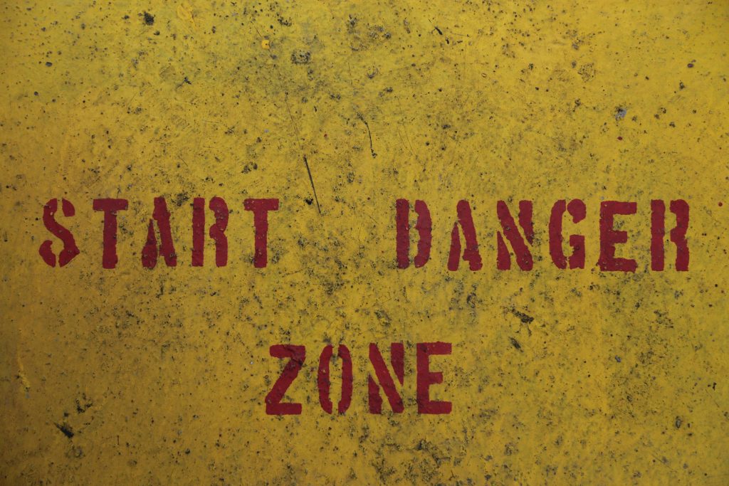 Yellow background with red text: start danger zone